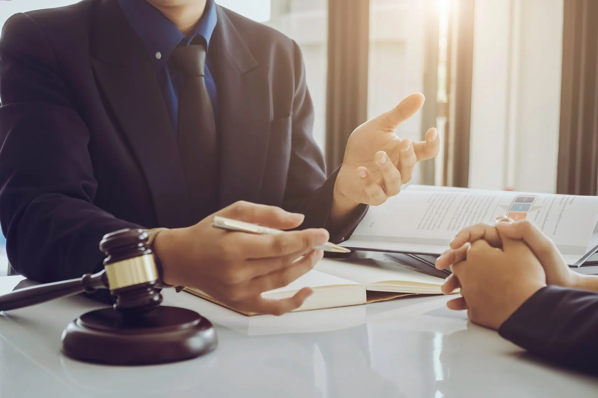 Lawyer while discussing legal matters | Threats And Intimidation | The Hemmat Law Group