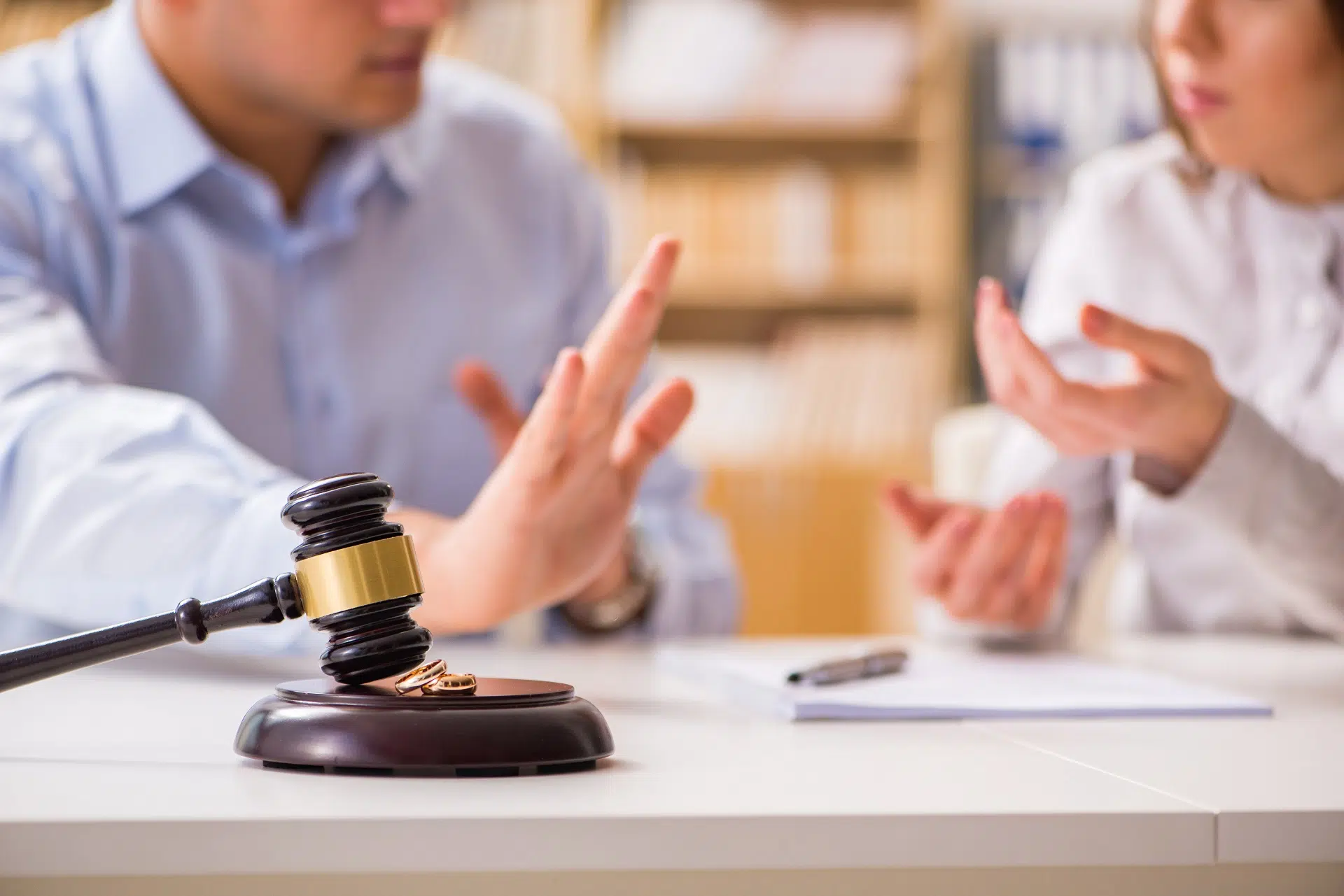 Wooden Gavel and Wedding Rings on a Desk | Divorce Lawyer Seattle | The Hemmat Law Group
