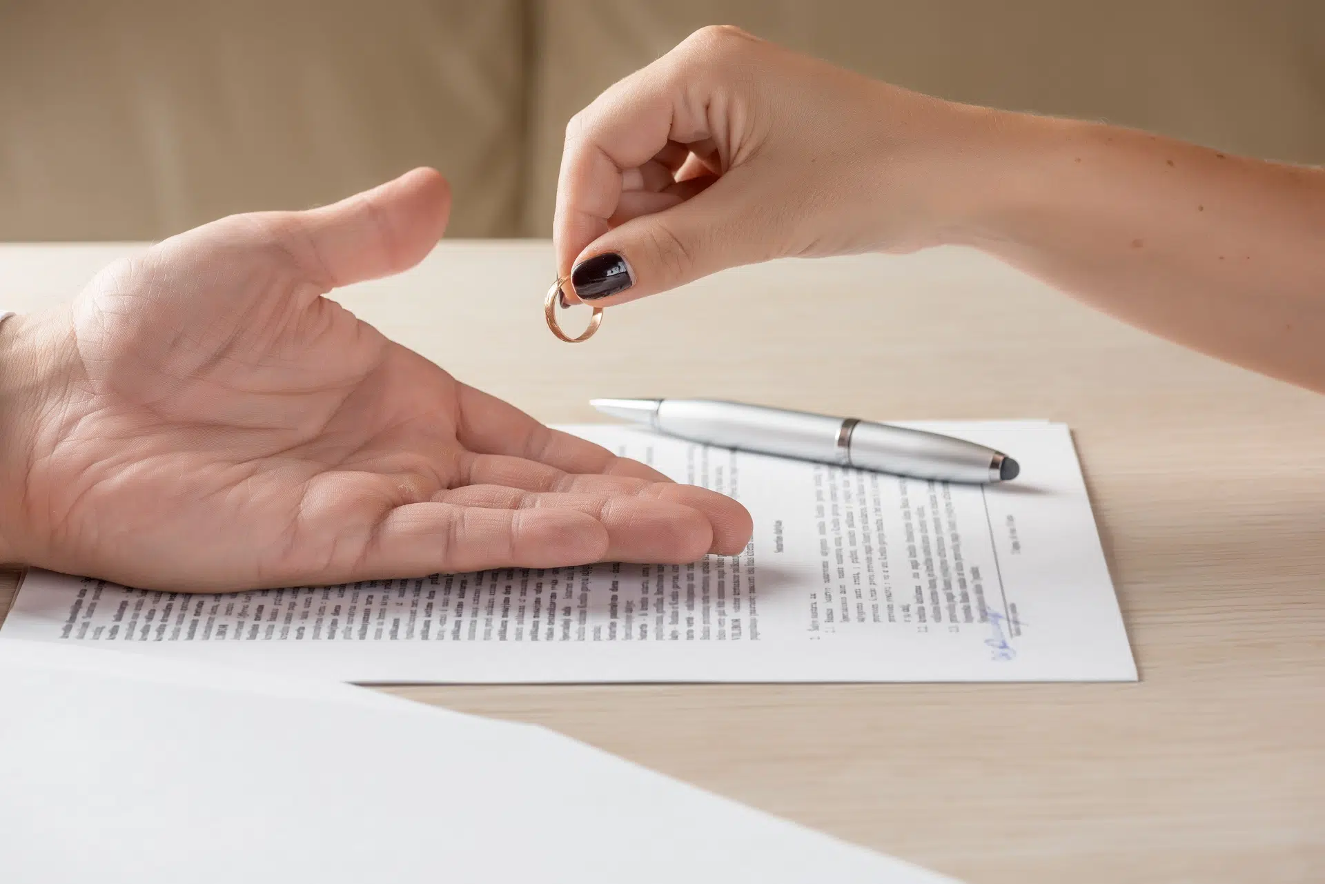 Hand returning wedding ring | Divorce Attorney Seattle | The Hemmat Law Group
