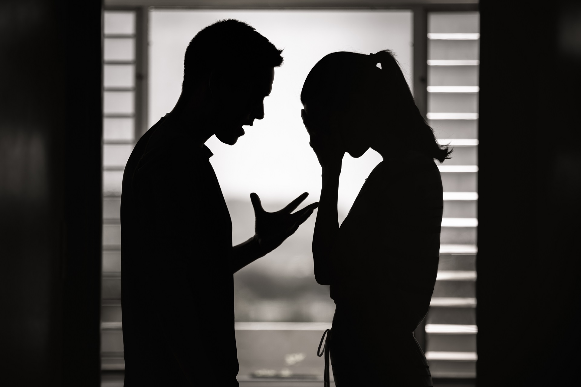 Silhouettes of Man and Woman in a Serious Conversation | Divorce Lawyer Seattle | Hemmat Law Group