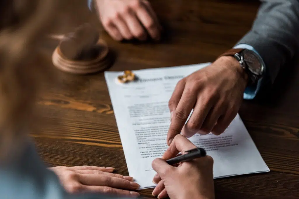 Two People Reviewing a Document During a Meeting | Divorce Lawyer Seattle | The Hemmat Law Group