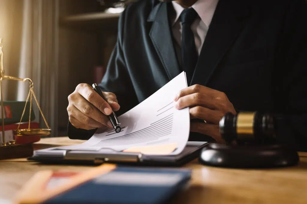 Attorney reviewing papers with client | Divorce Lawyer | The Hemmat Law Group