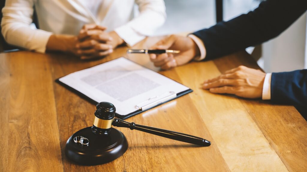 Two People in a Consultation with Legal Documents | Divorce Lawyer Seattle | Hemmat Law Group