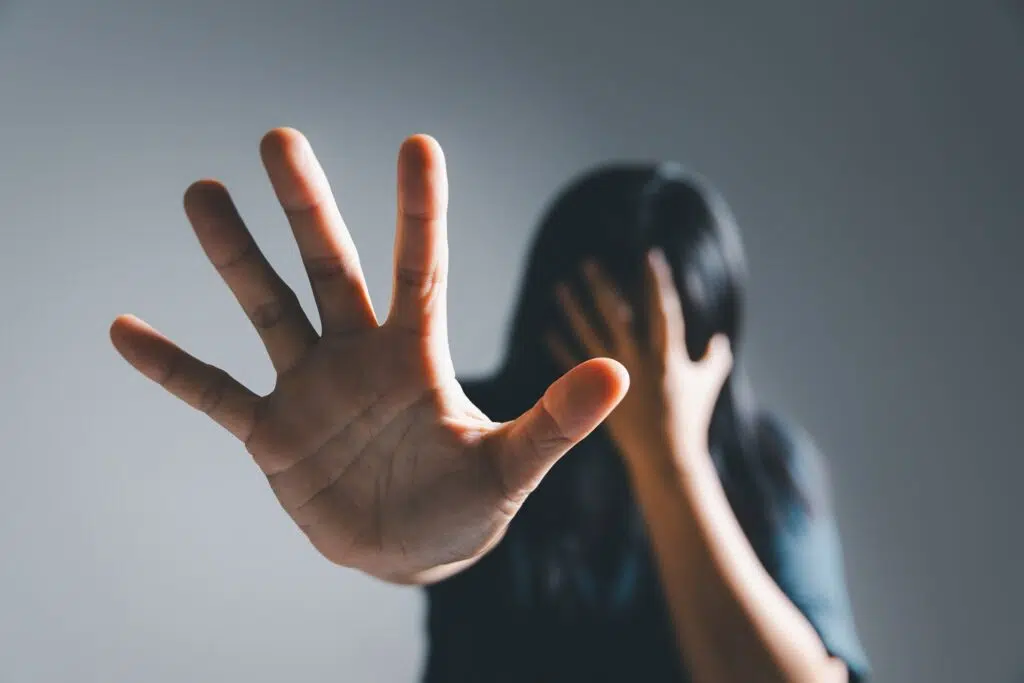 Person Gesturing Stop with an Outstretched Hand | Domestic Violence Lawyer | The Hemmat Law Group