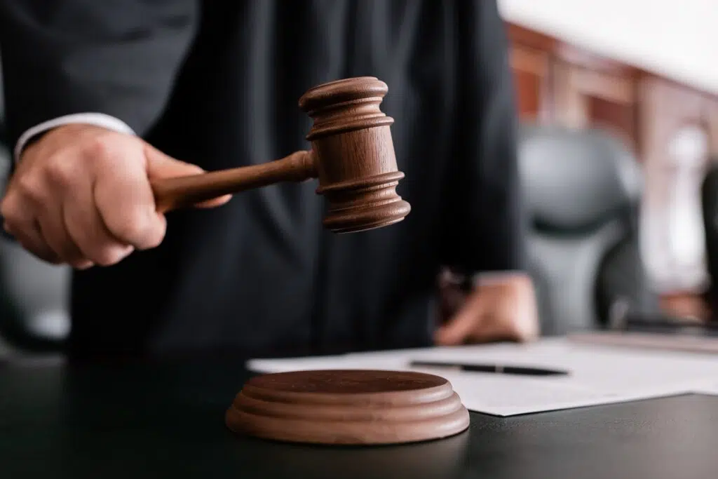 Judge in a Courtroom Wielding a Wooden Gavel | Domestic Violence Lawyer | The Hemmat Law Group