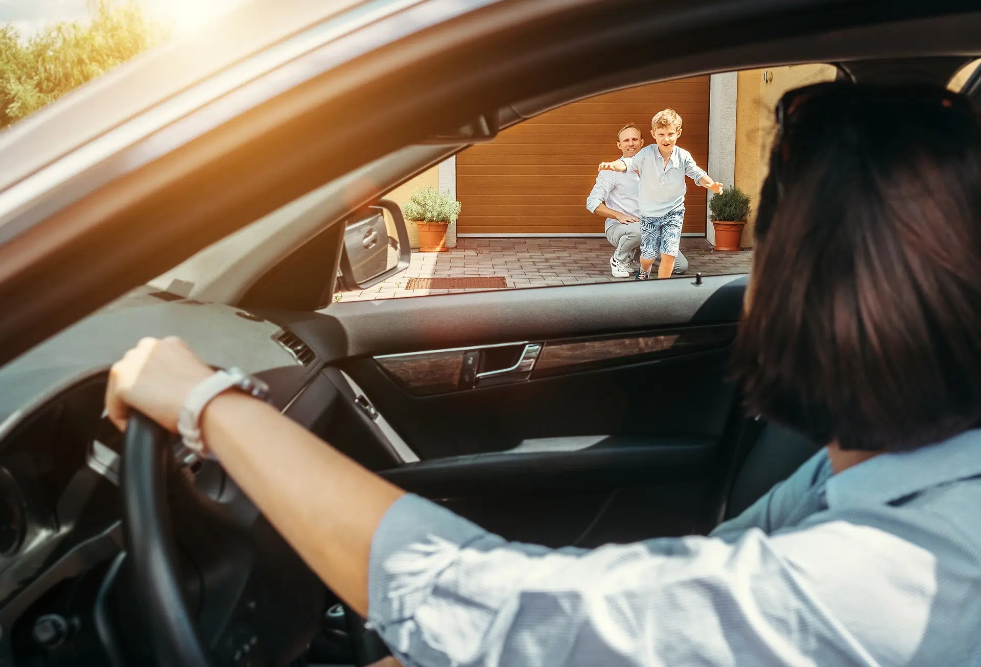 Woman driving toward her family outdoors | Child Custody Lawyer | The Hemmat Law Group