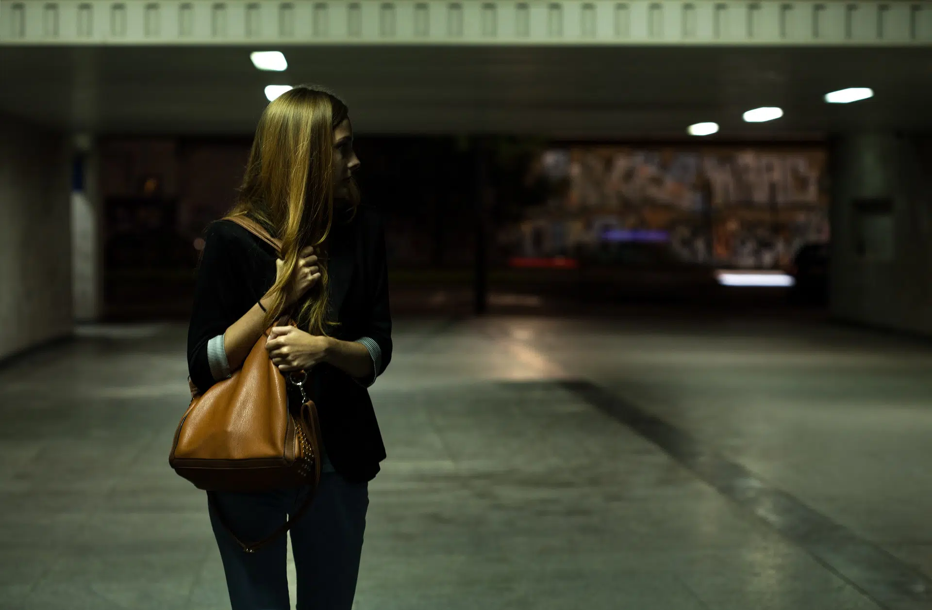 A woman with long hair and a purse | family law attorney seattle | The Hemmat Law Group