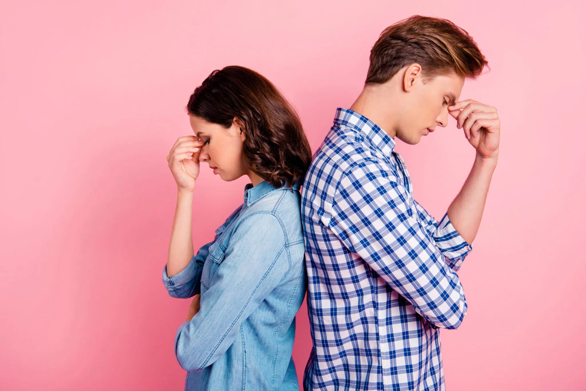A man and a woman stand back-to-back | mediation attorney | The Hemmat Law Group