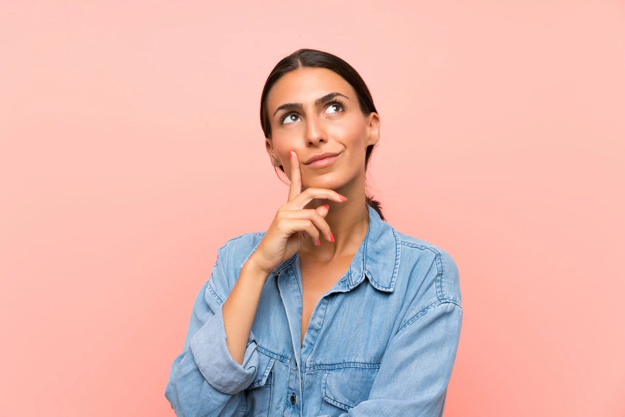 Woman looking up and thinking, with her finger on her chin | Family Lawyer | The Hemmat Law Group