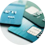 Three credit cards, one blue, one green, one teal | mediation services | The Hemmat Law Group