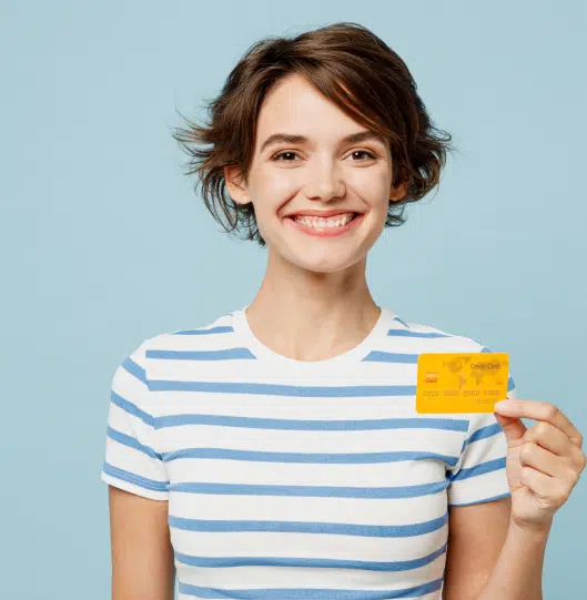 Smiling person holding a gold credit card | divorce lawyer | The Hemmat Law Group