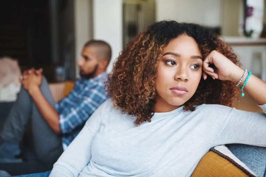 A woman looks away from a man | Divorce Lawyer | The Hemmat Law Group