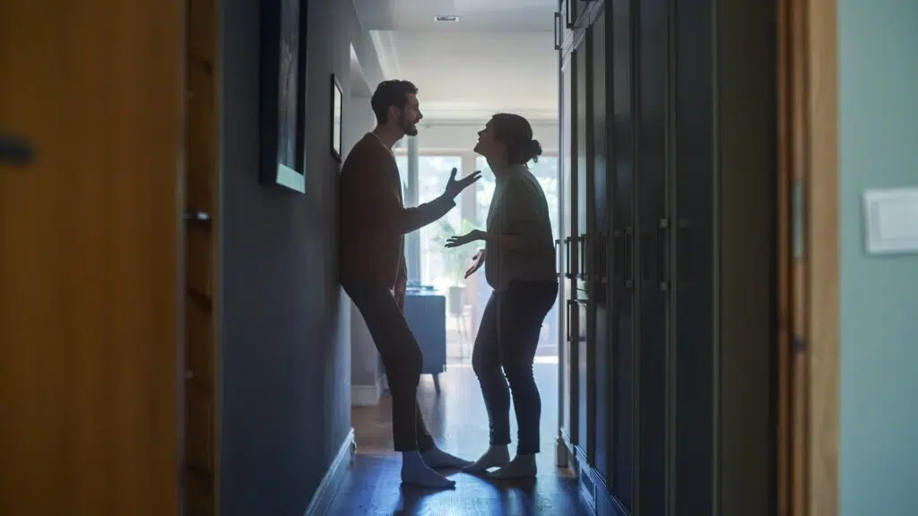 A tense confrontation in a hallway | Domestic Violence Lawyer | The Hemmat Law Group