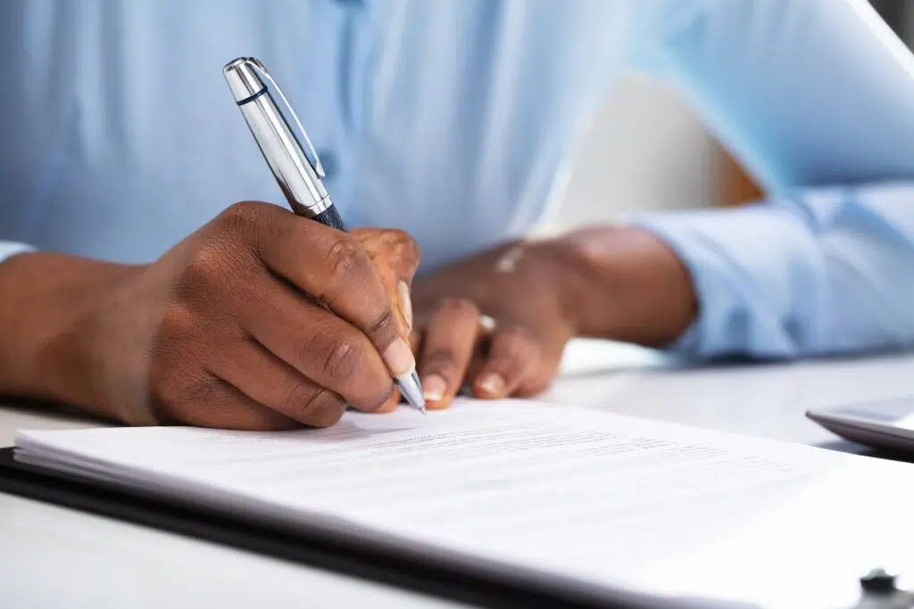 Hand signing protection orders for LGBTQ community | family attorney seattle | The Hemmat Law Group