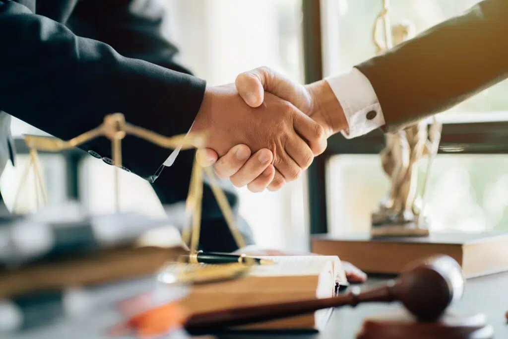 Lawyer shaking hands with client | Family Mediation | The Hemmat Law Group