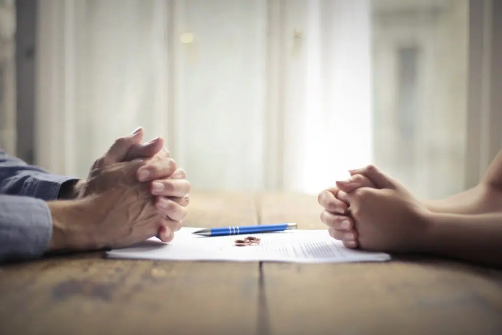 Two people's clasped hands facing each other | Family Law Attorney | The Hemmat Law Group