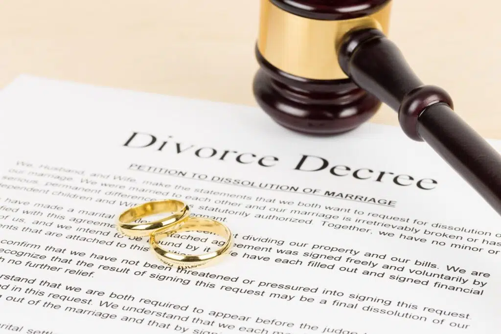 Divorce decree document, gavel, and wedding rings | family lawyer seattle | The Hemmat Law Group