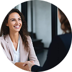 Smiling female professional speaking with a client indoors | Hemmat Law Group