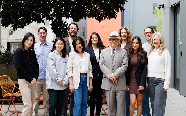 Hemmat Law team posing together outdoors near their office | Hemmat Law Group