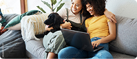 Mother and daughter relaxing together while using a tablet | Hemmat Law Group