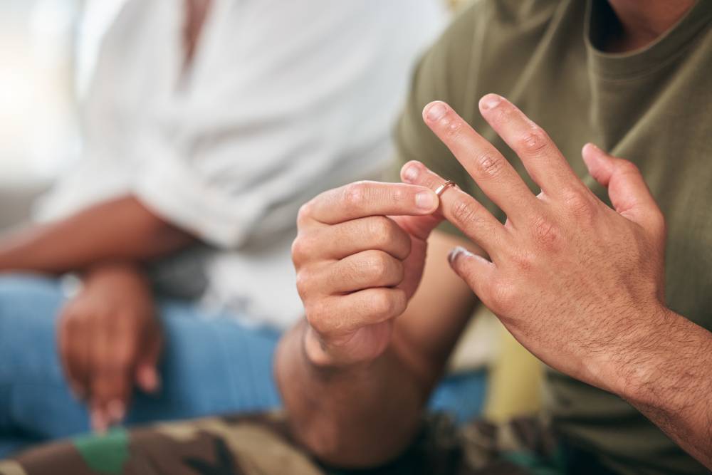 Person removing a wedding ring during a difficult separation | Hemmat Law Group