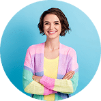 Smiling woman in colorful sweater with arms crossed | Hemmat Law Group