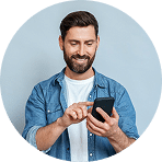 Man smiling while checking messages on his smartphone | Hemmat Law Group