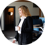 Professional woman smiling in a circular photo | Hemmat Law Group