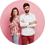 Unhappy couple standing apart against a soft pink background | Hemmat Law Group
