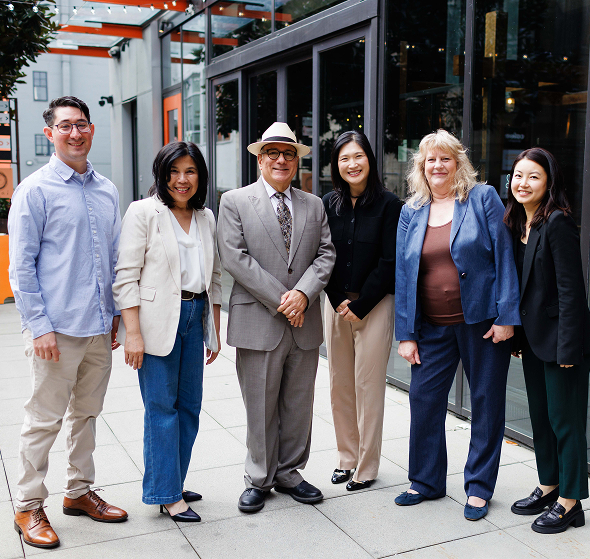 Hemmat Law team members posing together outside the office | Hemmat Law Group