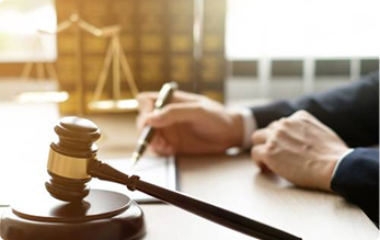 Judge's gavel beside legal documents on an office desk | Hemmat Law Group