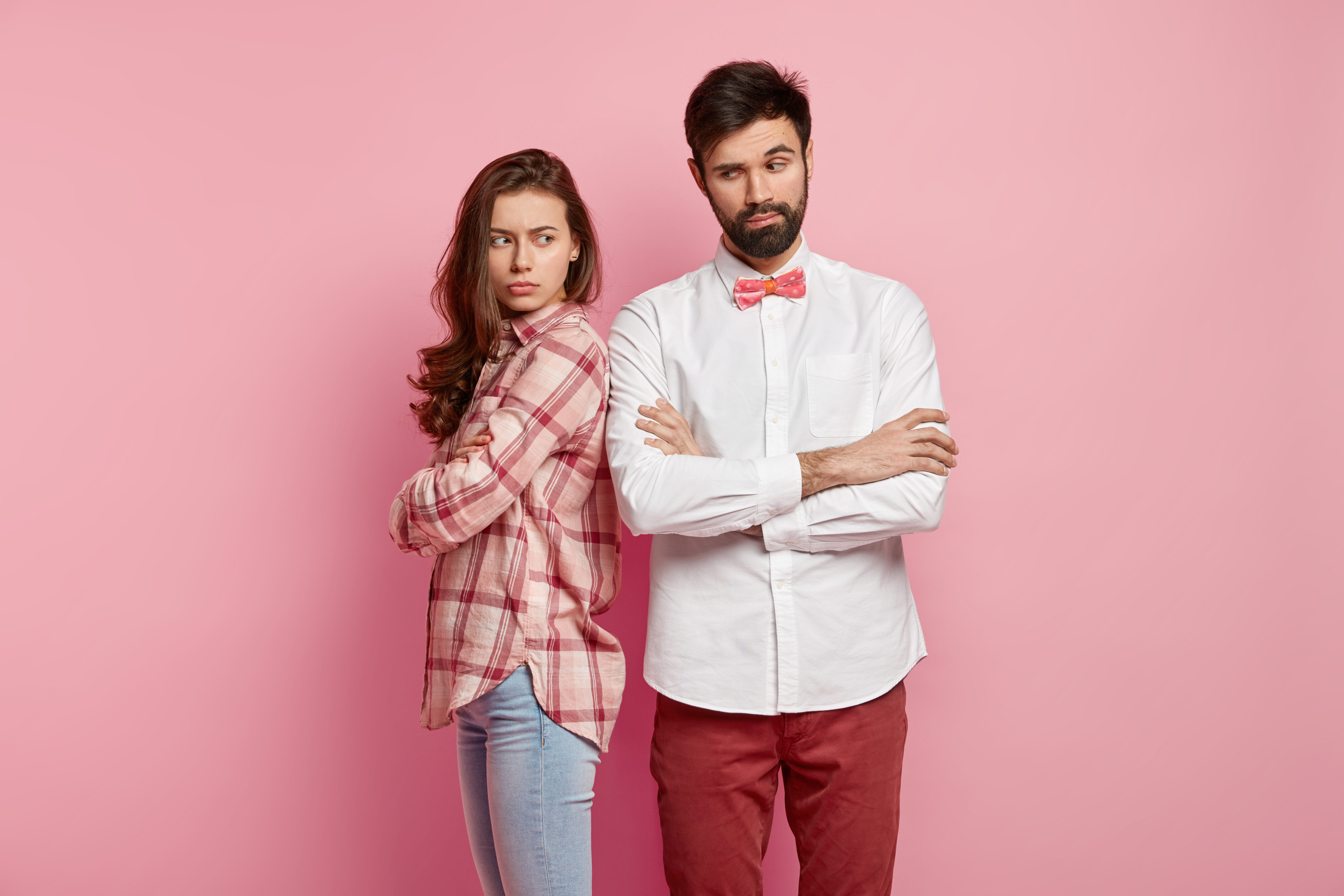 Couple standing back-to-back looking annoyed | Hemmat Law Group
