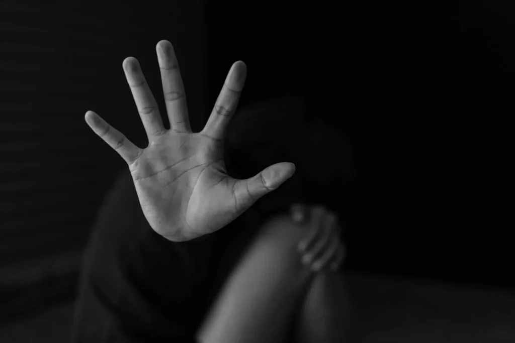 Person raising hand defensively | Hemmat Law Group