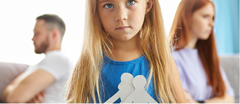 Young girl holding paper family figures with parents behind | Hemmat Law Group