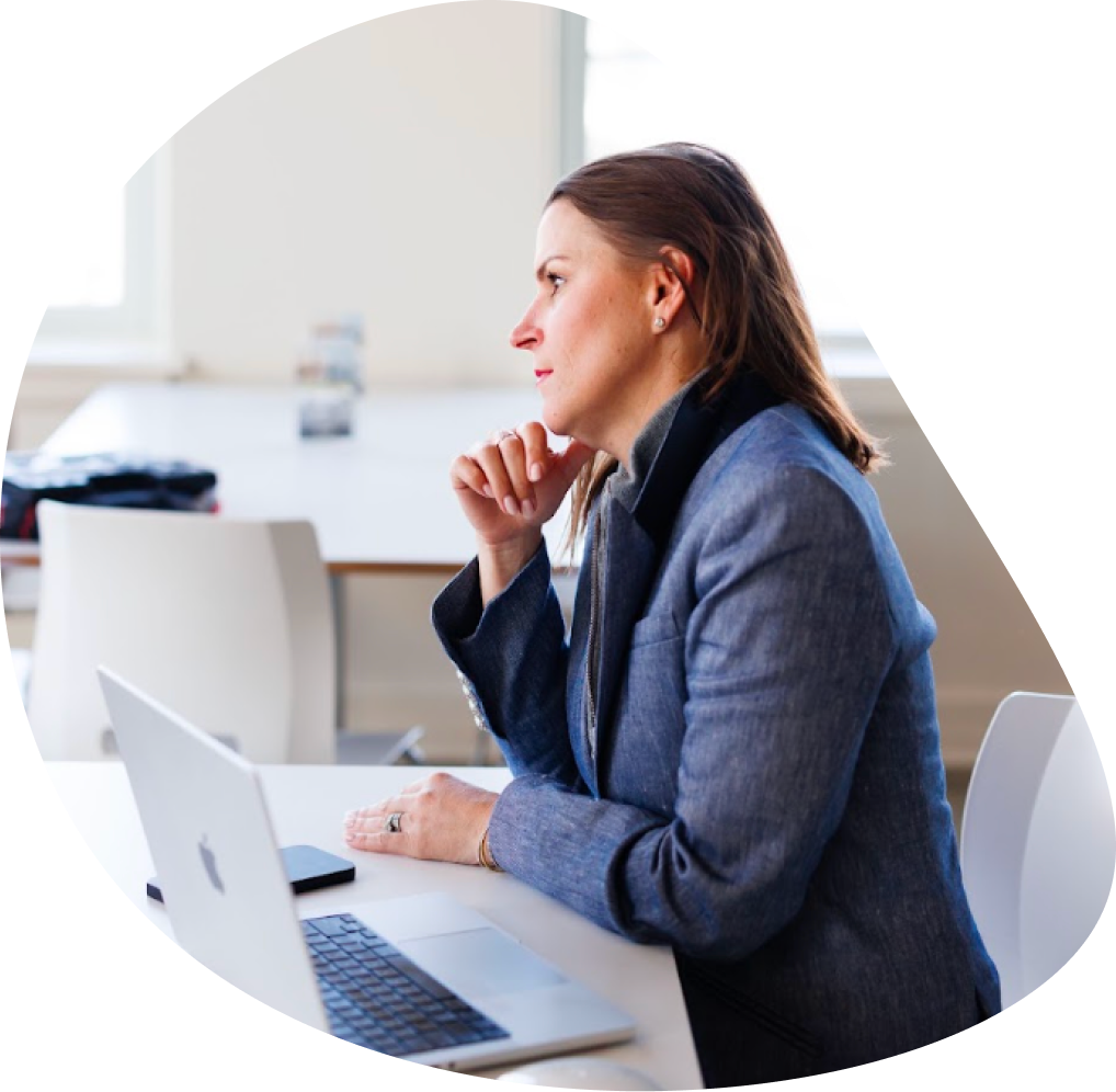 Businesswoman thinking while using a laptop | Hemmat Law Group