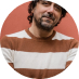 Smiling bearded man in striped shirt shown in round portrait | Hemmat Law Group