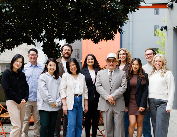 Hemmat Law Group team gathered outdoors for a professional photo | Hemmat Law Group