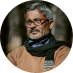 Bearded man with glasses smiling in a circular portrait photo | Hemmat Law Group