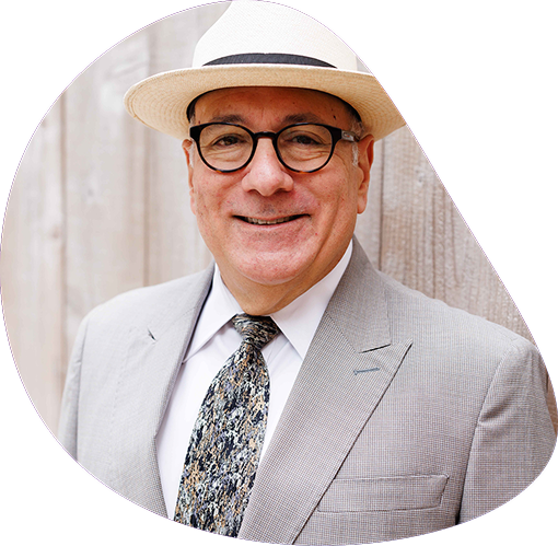 Professional male attorney wearing glasses, suit and white hat | Hemmat Law Group