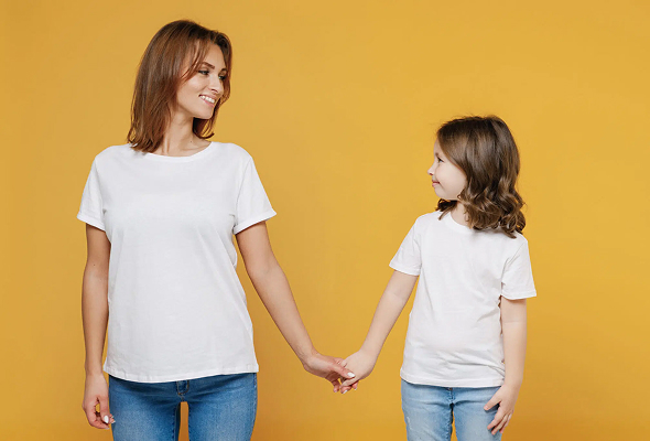 Mother and daughter holding hands against a yellow background | Hemmat Law Group